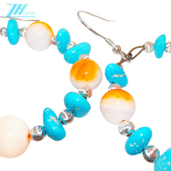 Sterling treatment Turquoise and natural Orange spiny oyster combine to form earrings With a unique shape they are like a beautiful dream blooming by the ear swaying gracefully