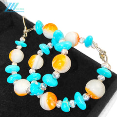 Sterling treatment Turquoise and natural Orange spiny oyster combine to form earrings With a unique shape they are like a beautiful dream blooming by the ear swaying gracefully