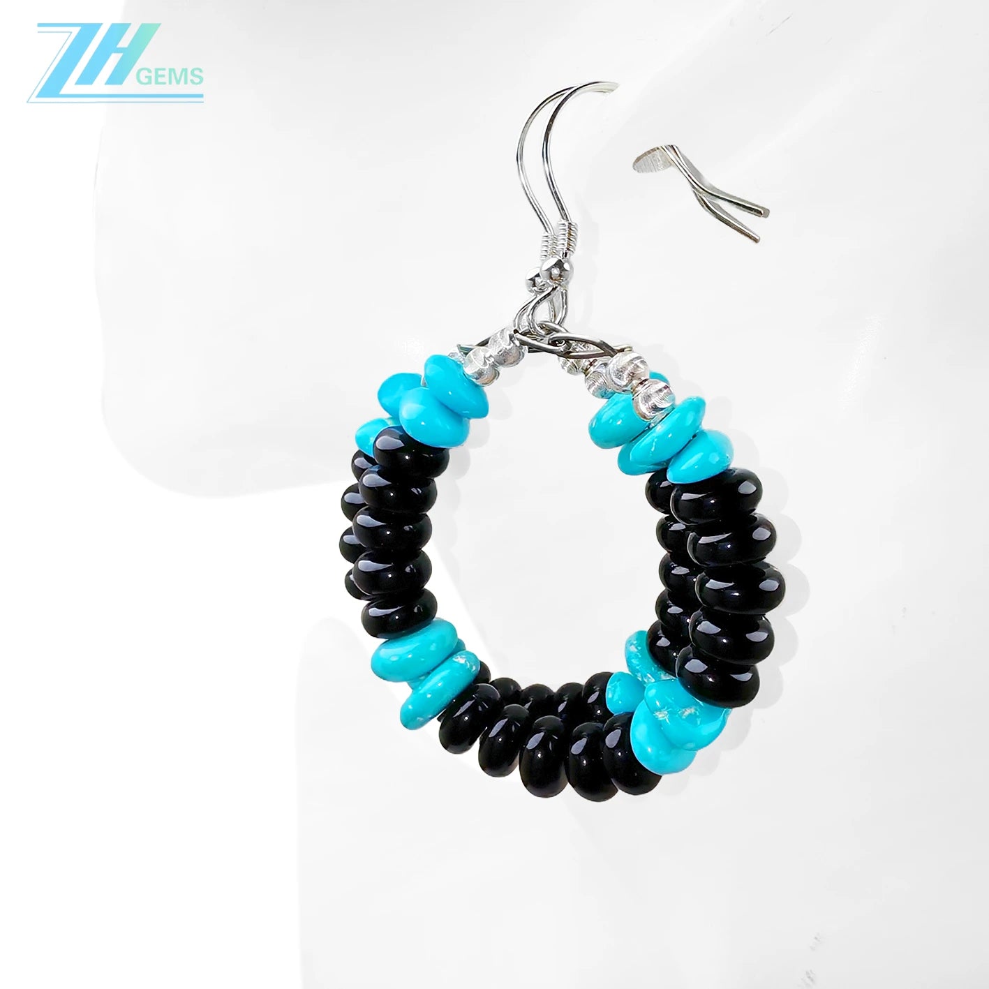 Natural Obsidian and natural Sterling treatment Turquoise form gemstone earrings They are small and delicate adding a mysterious and unique color to the ears