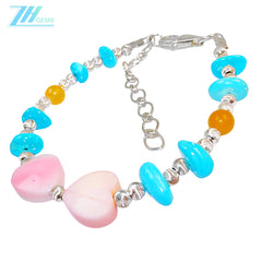 Made Of S925 Silver And Natural Turquoise This Bracelet Is Decorated With A Pink Opal Heart Shaped Pendant It's Delicate